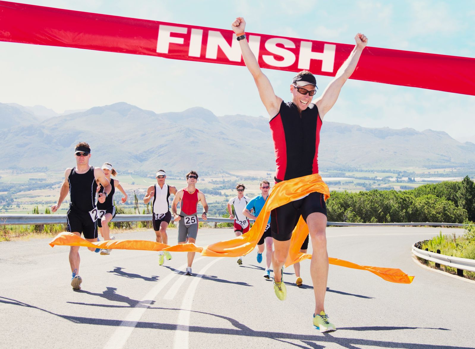 Runner crossing race finish line